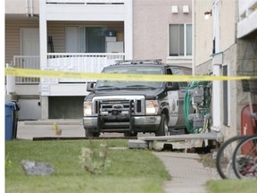 Police secure the scene of an early morning shooting in the 7700 block of 41st Avenue N.W. on Monday.