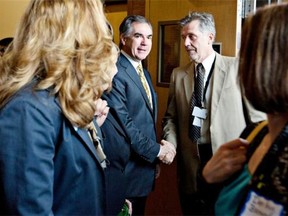 Jim Prentice is greeted by supporters before launching his campaign for the Progressive Conservative leadership in Edmonton on Wednesday. (THE CANADIAN PRESS/Jason Franson)