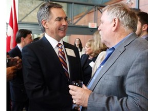 Jim Prentice, left, mingled with the crowd of 1,800 at the Telus Convention Centre prior to the annual premier’s dinner on Thursday but continued to play coy about whether he will declare his candidacy for the PC crown.

Colleen De Neve/ Calgary Herald 
 CALGARY, AB --MAY 8, 2014 -- Jim Prentice, left, mingled with the crowd of 1,800 at the Telus Convention Centre prior to the annual party Leaders Dinner on May 8, 2014. It is widely speculated that Prentice will throw his hat into the ring for the leadership of the party. 
 (Colleen De Neve/Calgary Herald) (For CITY story by James Wood) 
 00055260A SLUG: PC DINNER