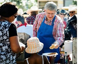 Prime Minister Stephen Harper was serving up pancakes at the Chinook Centre pancake breakfast on July 5, 2014.