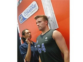 Prospect Aaron Ekblad performs a test during the NHL Combine last month. He recently was given the white-hat treatment by the Calgary Flames, flown in for a private visit with the team that picks fourth overall in next week’s draft.