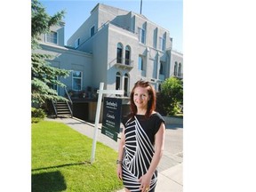 Realtor Julie Dempsey outside one of her listings in the Lindsay Park Place building in the Mission area of Calgary.