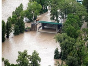 The Prince's Island Park stage, home to the Calgary Folk Festival in a few short weeks, sits surrounded by Bow River floodwaters as seen from the air Friday June 21, 2013.