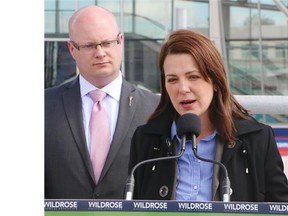(Ted Rhodes/Calgary Herald) 
 Danielle Smith, leader of the Wildrose Party, with Municipal Affairs critic Jeff Wilson, left, and Finance critic Rob Anderson at the Crowfoot CTrain station Thursday.