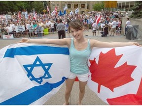 Roshana Weize, a young Jewish pro-Israel Canadian student, shows her pride at a peaceful pro-Israel rally with about 500 other supporters at City Hall on Thursday.