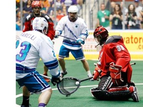 Roughnecks goaltender Mike Poulin stops this shot during the first half of the Calgary Roughnecks vs Rochester Knighthawks Champion’s Cup final game in Rochester on Saturday night.