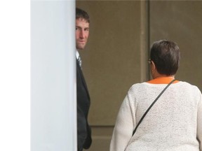Ryan Kramer walked from the Calgary Courts Centre with family during lunch break on September 2,