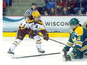 Sarah Davis of the Minnesota Golden Gophers scores past the defence of Vanessa Plante of the Clarkson Golden Knights during the 2014 NCAA Women’s Ice Hockey Championship. The Gophers later lost 5-4. Davis was picked third overall in the Canadian Women’s Hockey League draft by the Calgary Inferno.