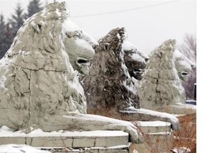 The sculptures, which were removed from Calgary’s Centre Street Bridge, sit in a snow storm in a City of Calgary yard.