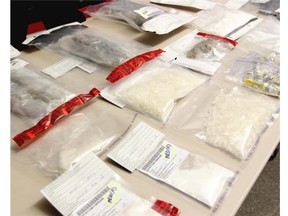 Search warrants yielded methamphetamine, cocaine, heroin, anabolic steroids, a cocaine conversion lab, semi-automatic handgun and a shotgun after a member of the notorious B.C.-based Red Scorpions gang and three associates were arrested following a co-ordinated series of search warrants in Red Deer County, Airdrie and Calgary.