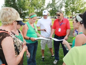 Searchers are briefed before heading out to search for clues in the disappearance of Nathan O’Brien and his grandparents.