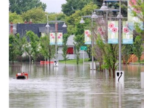 Sections of Memorial Drive remained flooded on Friday morning. The Bow River surged over the banks near Hillhurst, flooding the area.