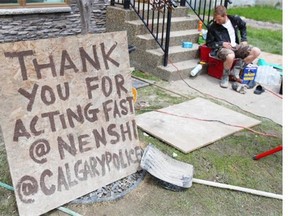 A sign thanked Nenshi, the city and police as residents and volunteers continued the arduous cleanup effort in Calgary’s Erlton neighbourhood on June 25, 2013.