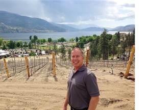 Skaha Hills 
 Curt Jansen, vice-president of sales for Skaha Hills, stands in the area where vines have been planted for the winery that will sit at the entrance to the community.