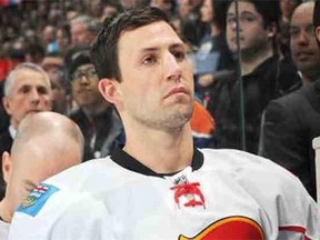 Cory Sarich, seen as a member of the Calgary Flames in 2013, suffered a life-threatening cycling accident last month near Winderemere, B.C.