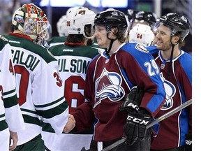Colorado Avalanche center Nathan MacKinnon (29) greets Minnesota Wild goalie Ilya Bryzgalov at the end of the first-round series in Denver on April 30, 2014. Like Sidney Crosby in 2006, Nathan MacKinnon will get a taste of Team Canada at the world championships at the age of 18.