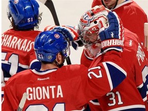 Canadiens captain Brian Gionta congratulates goalie Carey Price after his shut-out in Game 6 of Stanley Cup playoff series against the Boston Bruins in Montreal on Monday.