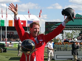Ian Millar and Dixson win the CP International Grand Prix at Spruce Meadows, in Calgary on September 14, 2014.(