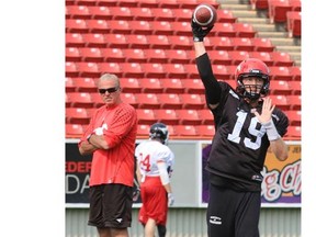 Stampeders head coach John Hufnagel puts his troops such as quarterback Bo Levi Mitchell through the paces as he prepares the team to take on the Ottawa RedBlacks Saturday at McMahon Stadium.