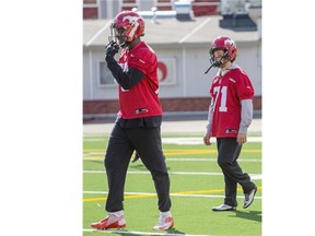 Stampeders receiver Aldarius Johnson, left, seen walking with kicker, made some noise during the team’s annual Red and White scrimmage on Sunday.