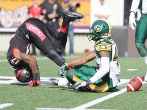 Stamps receiver Maurice Price does a sumersault after a good play in the second half on Monday.