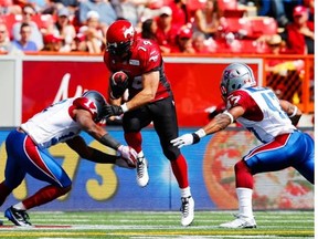 Stamps running back Matt Walter pushes through Alouettes defenders during the season-opening win over Montreal. Walter gets the ball again Saturday with Jon Cornish out with a concussion.