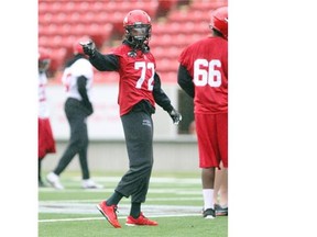 Stamps wide receiver Marcus Rucker practises in the rain at McMahon Stadium on Friday.