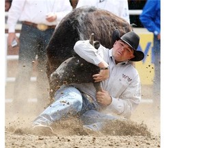 Steer wrestler Matt Reeves, seen competing at the 2011 Calgary Stampede, thought he’d broken a barrier on Tuesday’s blistering 3.5-second run, but he was clean. And happy.