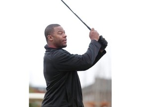 Calgary Stampeders' star Charleston Hughes takes part in the Henry Burris Celebrity Golf Tournament at Springbank Links Golf Course earlier this month. Hughes, a sackmaster on the field, isn't afraid to try new sporting pursuits.