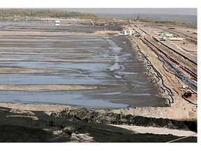 FILE PHOTO: Suncor combines tailings with a polymer, and the yogurt-like result is pumped into this settling area, where the water separates out and is reused at its site near Fort McMurray.