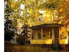 Sunset light warms the fall colours around a early 1900s home along 8th avenue in Inglewood on Tuesday evening Oct. 22, 2013.