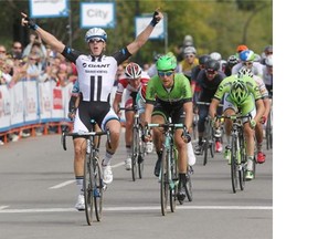 Team Giant Shimano rider Jonas Ahlstrand raises his arms as he crosses the line in first during Stage 2 of the Tour of Alberta from Innisfail to Red Deer on Thursday.