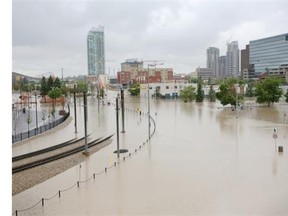 THEN: East Village and other areas of downtown are flooded in Calgary, Alberta on June 21, 2013.