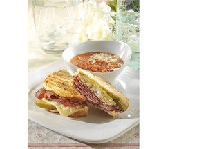 There are a few variations, but most agree that sauerkraut and Swiss cheese  are key to a great Reuben sandwich.