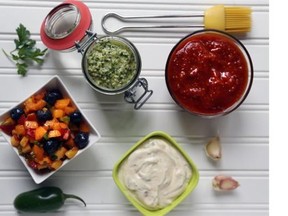 Use these bright-tasting sauces to flavour summer foods. From top: Canadian whiskey barbecue sauce; roasted garlic aioli; chimichurri sauce and summer fruit salsa.