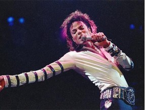 In this Feb. 24, 1988 file photo, Michael Jackson leans, points and sings, dances and struts during the opening performance of his 13-city U.S. tour, in Kansas City, Mo. The owners of technology used to create holograms of deceased celebrities on Thursday May 15, 2014, sued Jackson’s estate and the producers of Sunday’s Billboard Music Awards trying to block any use of their technology to generate a Jackson hologram during the show. (AP Photo/Cliff Schiappa, file)