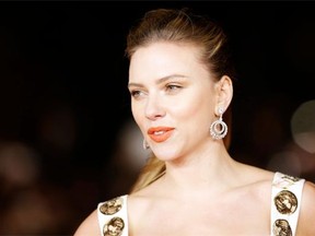 In this Nov. 10, 2013 file photo, actress Scarlett Johansson arrives for the screening of the film ‘Her’ at the 8th edition of the Rome International Film Festival in Rome. Israeli drink maker SodaStream International Ltd. recently signed the American actress as its first ìglobal brand ambassador.î Her first commercial is to debut during the Super Bowl on Feb. 2. SodaStream has come under fire from pro-Palestinian activists for maintaining a large factory in an Israeli settlement in the West Bank, a territory captured by Israel in 1967 and claimed by the Palestinians.(AP Photo/Alessandra Tarantino, File) ORG XMIT: DV102
