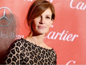 In this Jan. 4, 2014 file photo, Julia Roberts arrives at the Palm Springs International Film Festival Awards Gala at the Palm Springs Convention Center, in Palm Springs, Calif.  The Los Angeles coroner’s office is investigating the death  of Nancy Motes, 37, the half-sister of actors Julia and Eric Roberts. Motes was found dead in a Los Angeles home on Sunday, Feb. 9, 2014. (Photo by Jordan Strauss/Invision/AP, File)