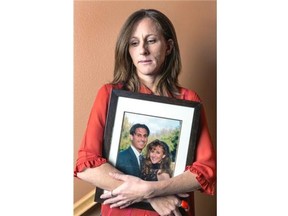 In this May 2014 photo, Kim Goldman holds a photo of herself with her late brother, Ronald Goldman, murdered with his friend Nicole Brown Simpson in 1994.