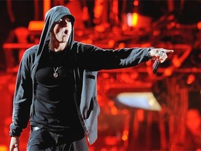 In this April 15, 2012 file photo Eminem performs at the 2012 Coachella Valley Music and Arts Festival in Indio, Calif. Eminem gave his estranged mom quite the Motherís Day gift, releasing a music video for an apologetic song that depicts her struggles raising the rebellious rapper. The Detroit rapper released the video for ìHeadlightsî featuring fun.ís Nate Ruess on Sunday, May 11, 2014. The song, released on Eminemís 2013 album ìThe Marshall Mathers LP 2,î is an extended apology to his mother Debbie for the difficulties he caused her over the years. (AP Photo/Chris Pizzello, File)