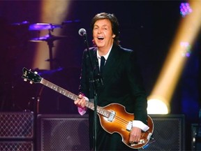 In this June 8, 2013 file photo, Paul McCartney performs during a concert at the Barclays Center, in New York. McCartney is canceling his entire Japan tour. The former Beatle got a virus last week and canceled several appearances, apologizing online to his fans. Now, his organizers say he is not well enough to do any of the concerts in Japan, including the one set for Wednesday, May 21, 2014, at Nippon Budokan hall, where the Beatles performed during their first 1966 Japan tour. (Photo by Jason DeCrow/Invision/AP, File)
