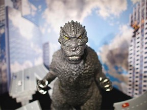 In this Monday, April 28, 2014 photo, a large size figure of Godzilla in a diorama is on display at Cheepa's gallery in Tokyo. Godzilla-lovers in this nation where the stomping all began say their iconic hero falls into a special phantasmal category called ìkaiju,î different from more mundane monsters like King Kong or Frankenstein. (AP Photo/Junji Kurokawa)