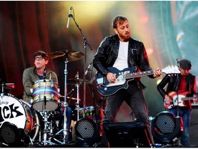 In this Sept. 29, 2012, file photo, guitarist Dan Auerbach, center, and drummer Patrick Carney of The Black Keys perform at the Global Citizen Festival in Central Park in New York. The band plays the Saddledome Oct. 27.