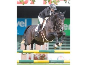 Tiffany Foster of Canada competes in the Bantrell Cup riding Triple X III at Spruce Meadows in Calgary on Wednesday.