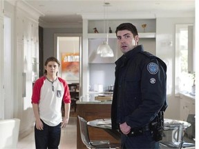 Travis Milne, right, in Rookie Blue. The series is in its fifth season.