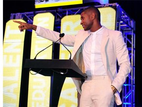 Usher speaks at the 15th Anniversary Celebration of Usher’s New Look at the President’s Circle Awards Luncheon on July 31, 2014 in Atlanta, Georgia.  (Photo by Moses Robinson/Getty Images for Usher’s New Look Foundation)