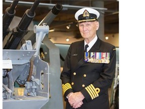 FILE PHOTO: Herald Calgary, AB; JUNE 6, 2014 — Retired Royal Canadian Navy Captain, and D-Day veteran, W.H. Wilson poses at the Military Museum in Calgary on Friday June 6, 2014.