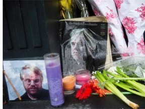 A vigil of candles, flowers and portraits sits outside the apartment of actor Phillip Seymour Hoffman. A jazz musician arrested on drug charges amid an investigation into actor Philip Seymour Hoffman's death is getting support from Blondie singer Deborah Harry.