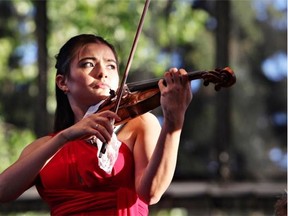 Violinist Karen Gomyo performs with the Edmonton Symphony Orchestra during the first night of Symphony Under the Sky at Hawrelak Park in Edmonton in 2010.  Gomyo performed with the Calgary Philharmonic Orchestra on Friday.