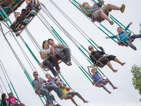 Visitors enjoy the swings on the Dream Machine at Calaway Park in Calgary on the weekend.